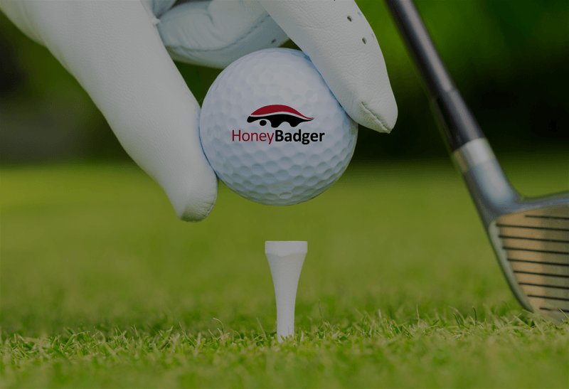 HoneyBadger golf ball logo